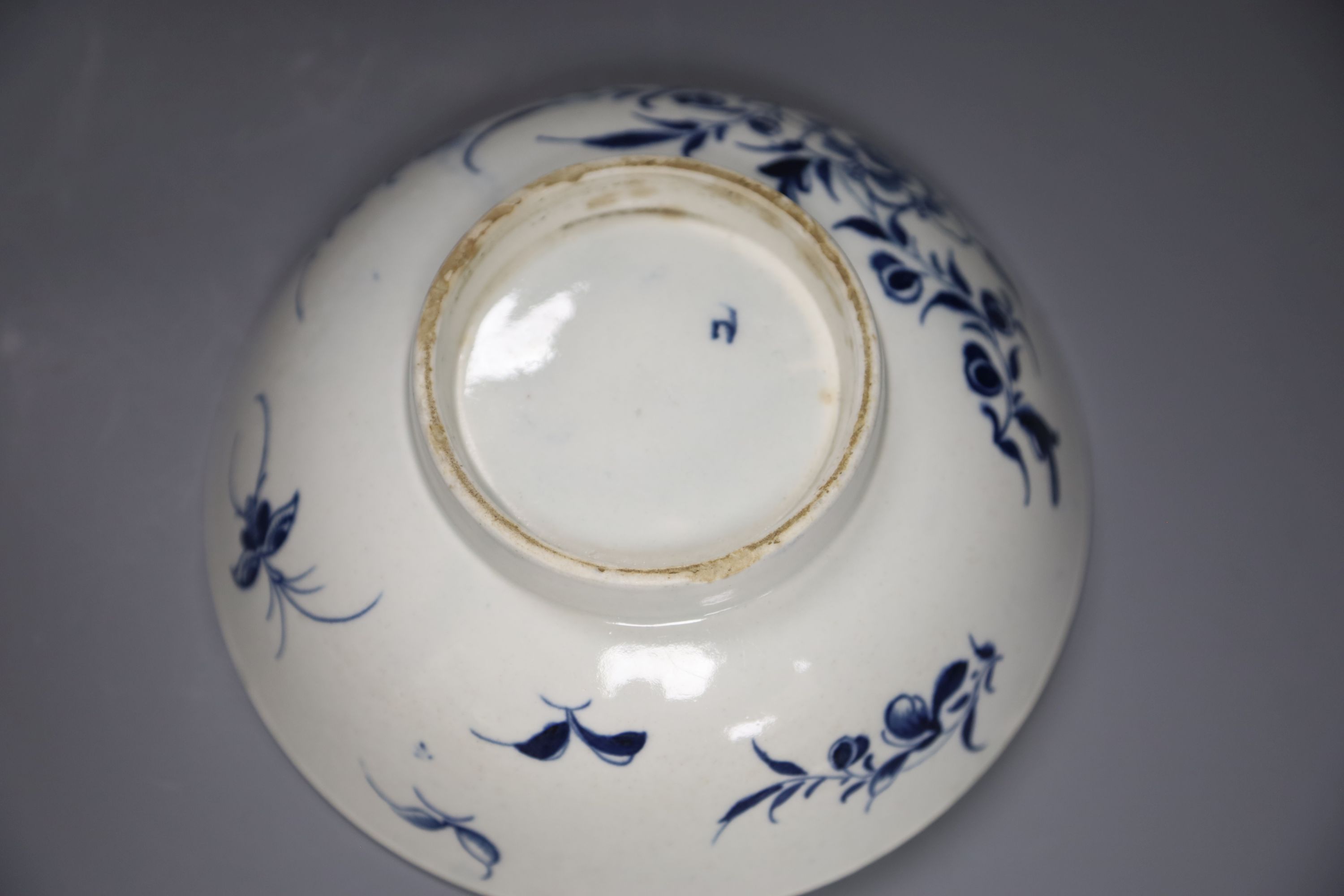 An 18th century Worcester bowl painted with the Peony pattern in blue, Workmans mark in blue to base, diameter 19cm